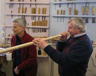 Olaf blowing an Oseberg
            replica